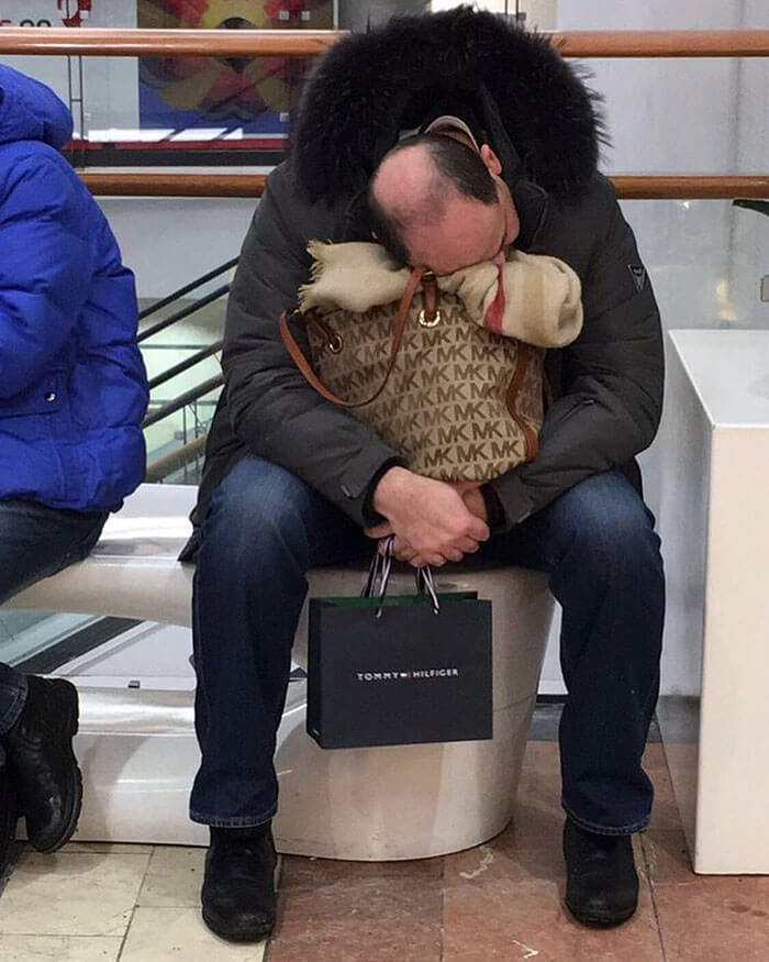 50 Hilarious Pictures Of 'Miserable Men' Waiting While Their Wives Were Shopping 12