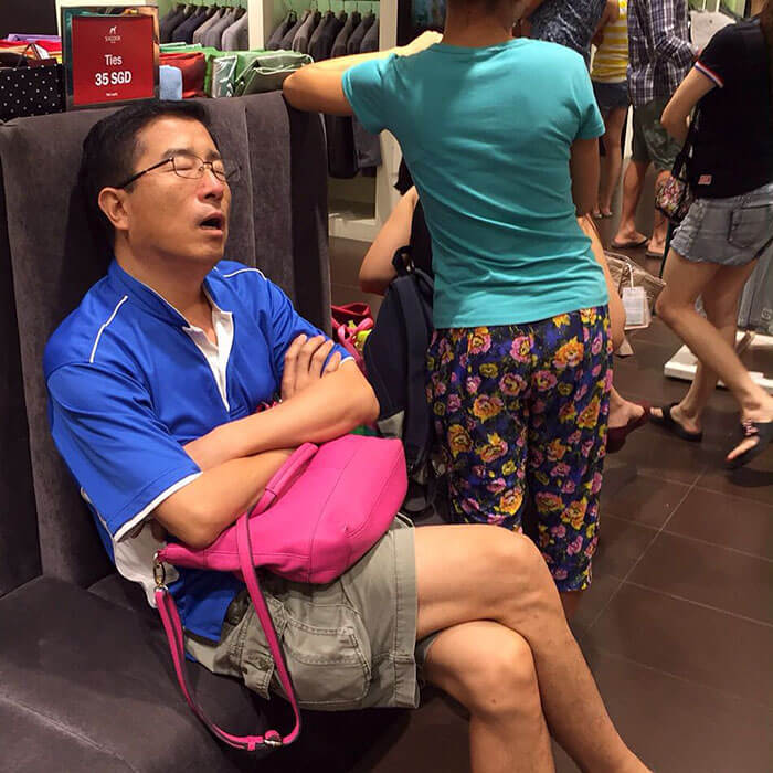 50 Hilarious Pictures Of 'Miserable Men' Waiting While Their Wives Were Shopping 31