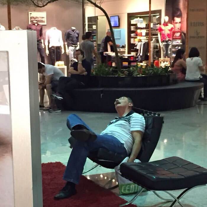 50 Hilarious Pictures Of 'Miserable Men' Waiting While Their Wives Were Shopping 32