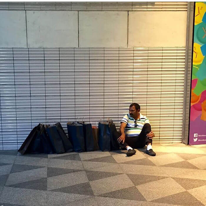 50 Hilarious Pictures Of 'Miserable Men' Waiting While Their Wives Were Shopping 39