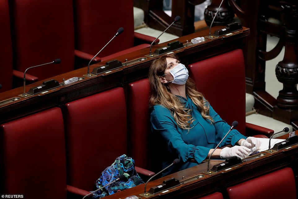 25848058 8101135 Rome_s_Deputy_Maria_Teresa_Baldini_wears_a_protective_mask_and_g A 39_1583962033345