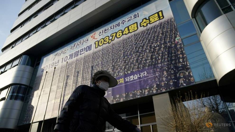 A Woman Wearing A Mask To Prevent Contracting The Coronavirus Walks Past A Branch Of The Shincheonji Church Of Jesus The Temple Of The Tabernacle Of The Testimony In Daegu 1