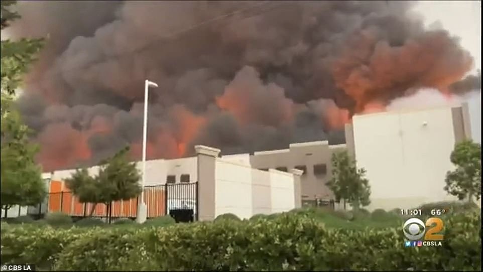 29279532 8393533 With_the_building_s_roof_completely_scorched_off_some_flames_wer A 34_1591399361713