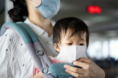 Asian Baby Mother Baby Carry Both Wearing Protection Mask Against Air Pollution Corona Virus Mother Ensure Baby Wear 172234244