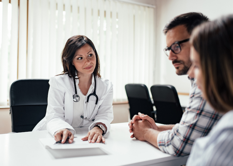 Doctor Explaining Results To A Couple.