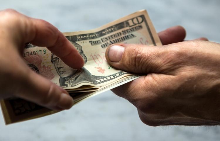 IStock Handing Cash