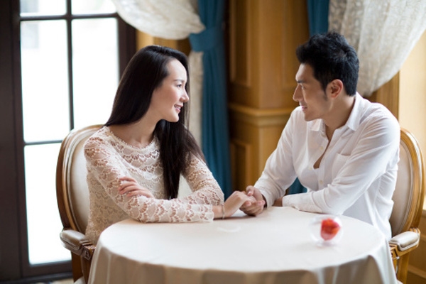 Young Couple Dating In Restaurant