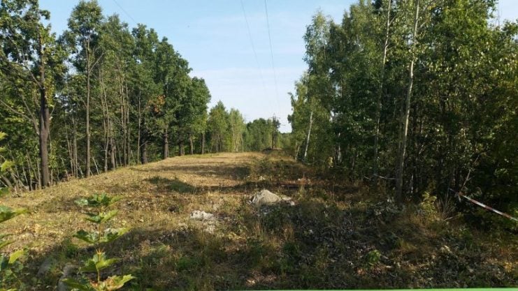 Railway embankment at “Zone 65”, near the crossing of Uczniowska Street, Wałbrzych, where it was claimed the Gold Train was hidden Photo by RafalSs – CC BY-SA 4.0