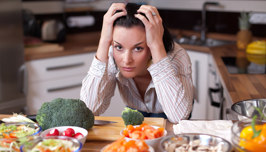 Depressed And Sad Woman In Kitchen