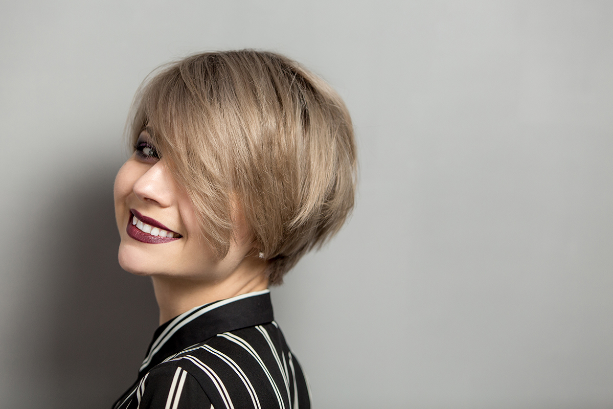 Fashion,Beautiful,Young,Woman,With,Short,Hair,Over,Gray,Background