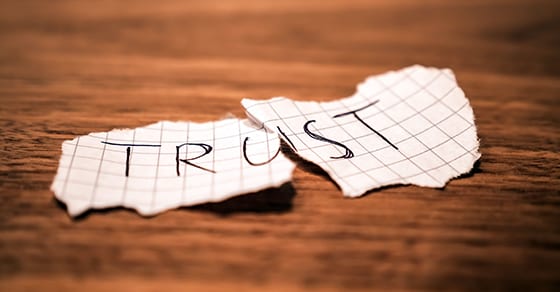 Torn Piece Of Paper With Word Trust On It