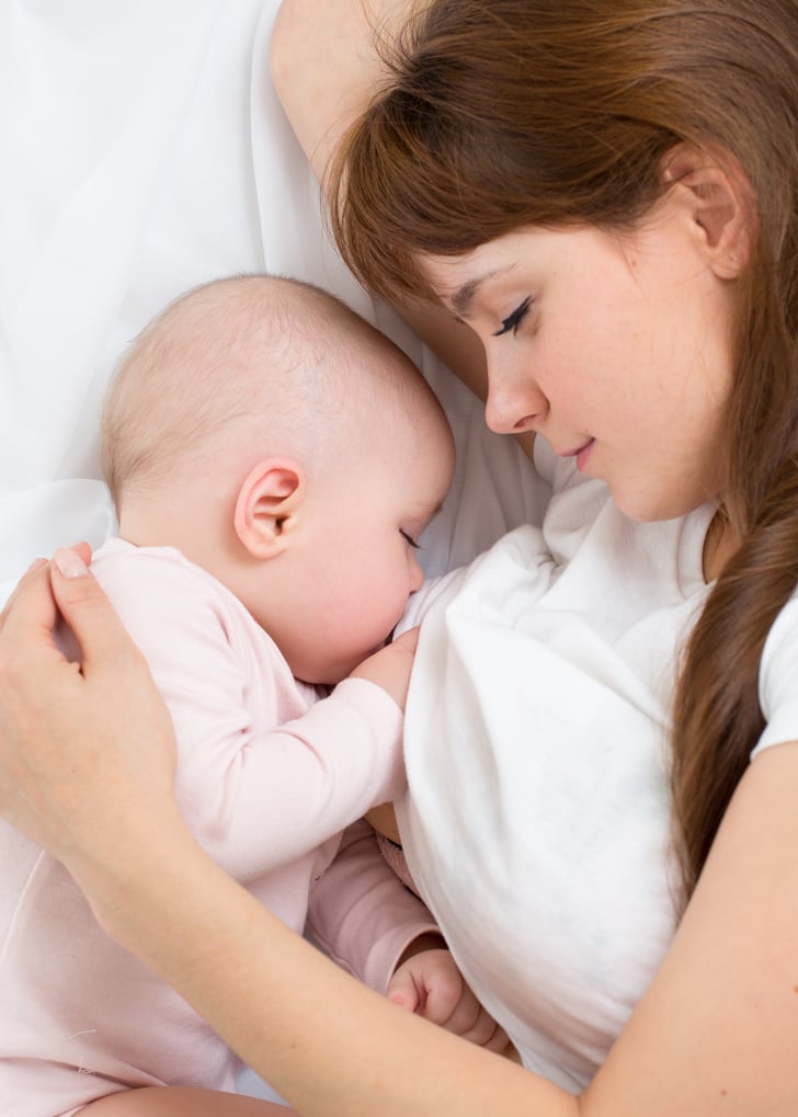 Young Mother Breastfeeds Her Baby. Breast Feeding.