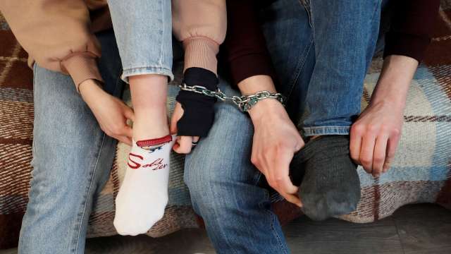 963763 Chained Couple