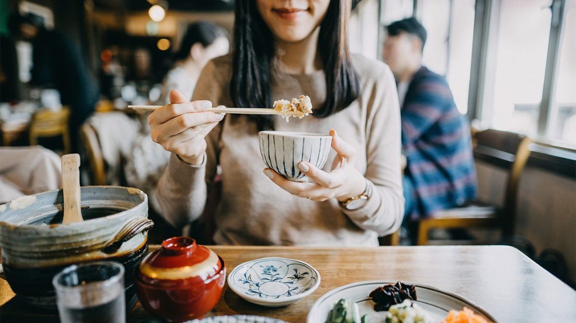 Japanese Woman Eating Restaurant Rice 1296x728 Header 1296x728