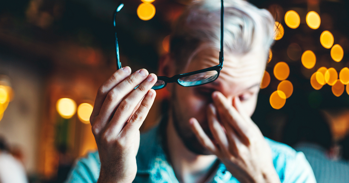 Man Holding Eyeglasses In His Hand And Rubbing Eyes 1200x628 Facebook
