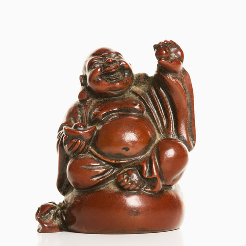 Happy,Laughing,Buddha,Figurine,With,Hand,Raised,In,Blessing,On