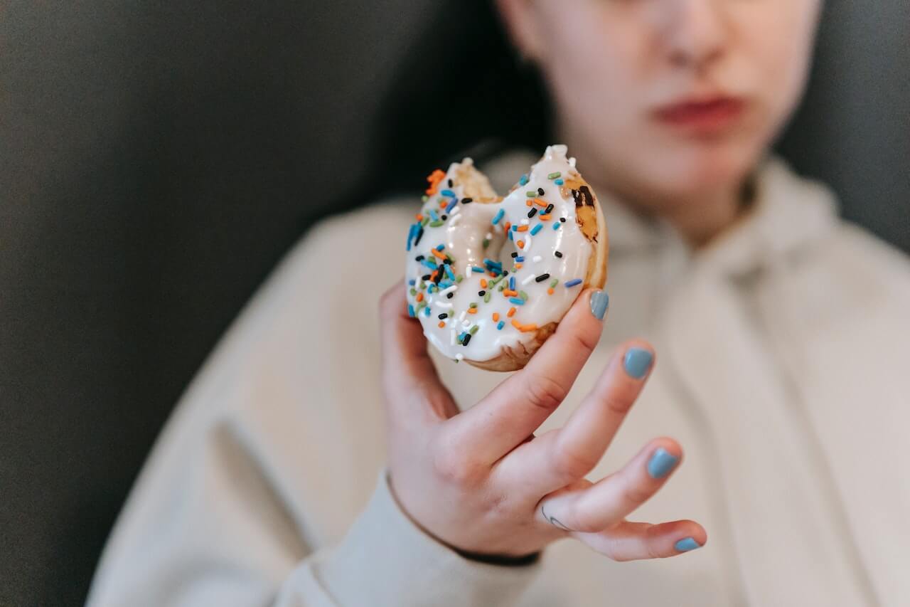 65415322be7630f5523cfbac_woman Holding Donut After Biting It