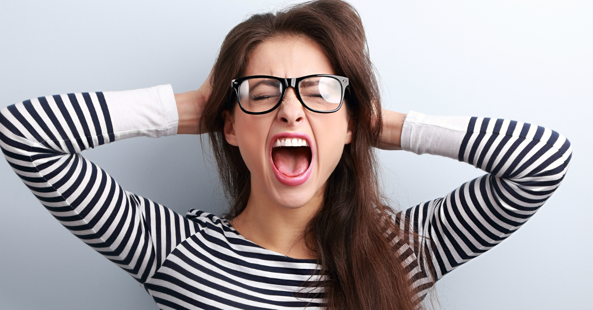 7217 Angry Woman Holding Head Screaming Gettyimage