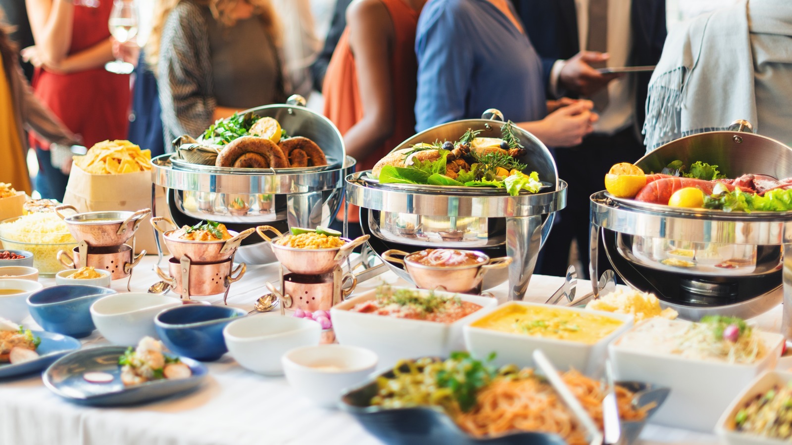Buffet,Table,With,Variety,Dishes,At,A,Social,Event.,Happy