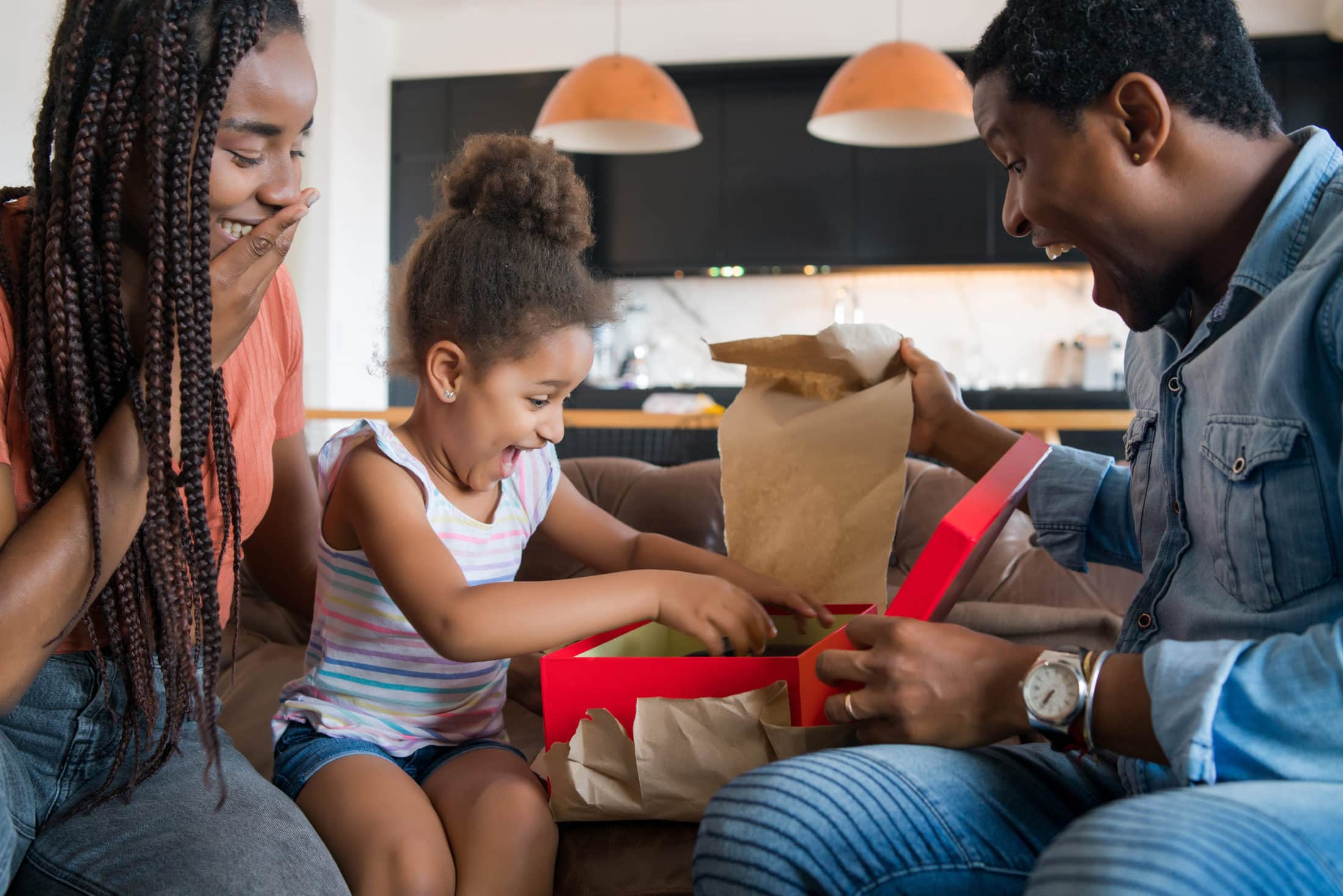 Little Girl Receiving Gift From Her Parents 2021 04 22 23 31 03 Utc Scaled